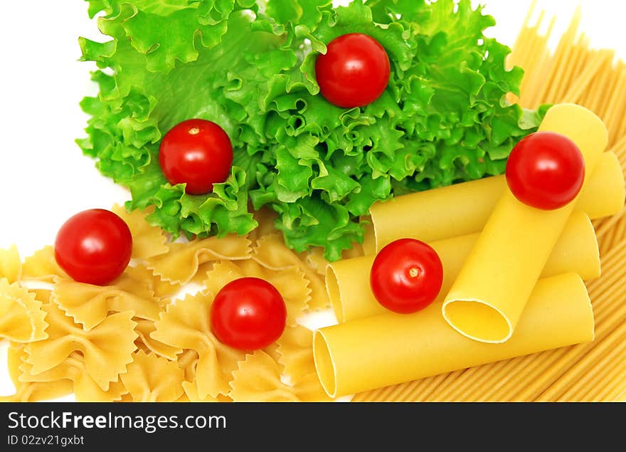 Macaroni and tomatoes on white background. Macaroni and tomatoes on white background