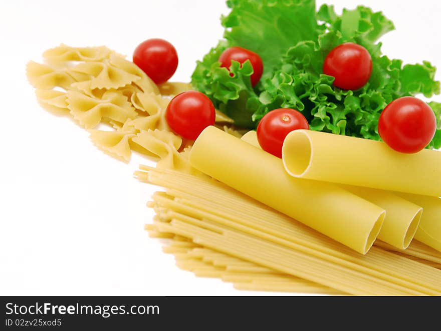 Macaroni and tomatoes on white background. Macaroni and tomatoes on white background