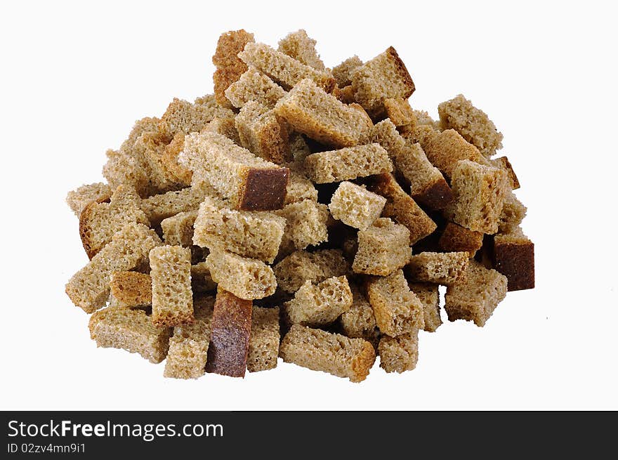 Pile of home-made brown rusks over white background. Pile of home-made brown rusks over white background