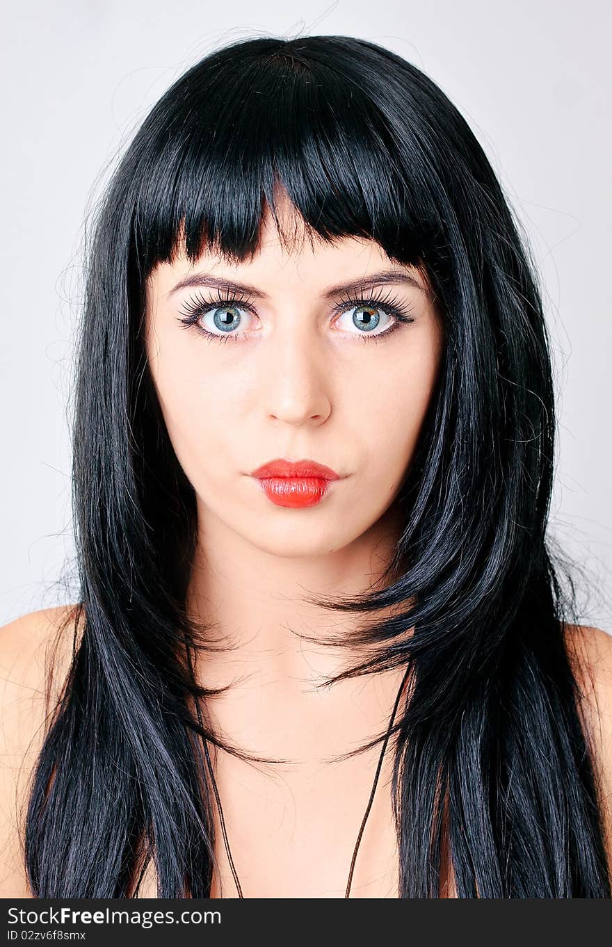 Young woman with red lips. Studio shot.