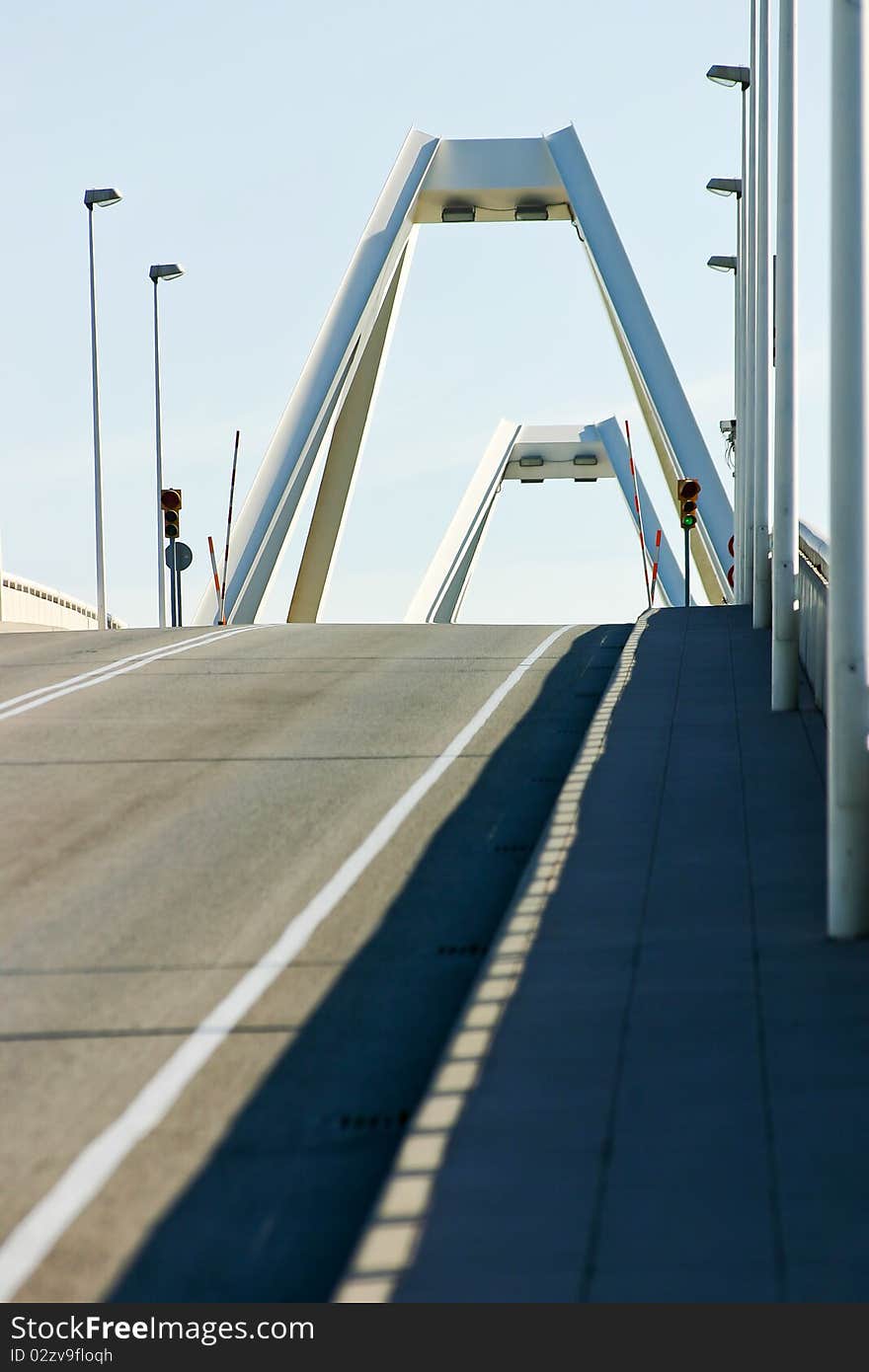 Asphalt road going over the bridge