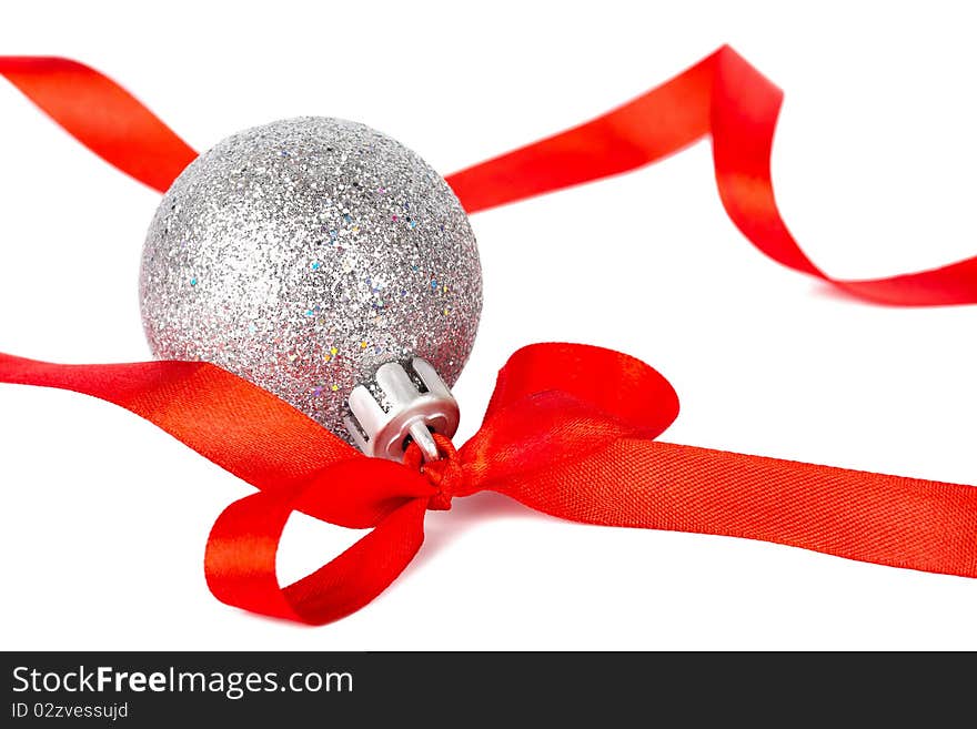 Christmas silver ball with red ribbon isolated on white