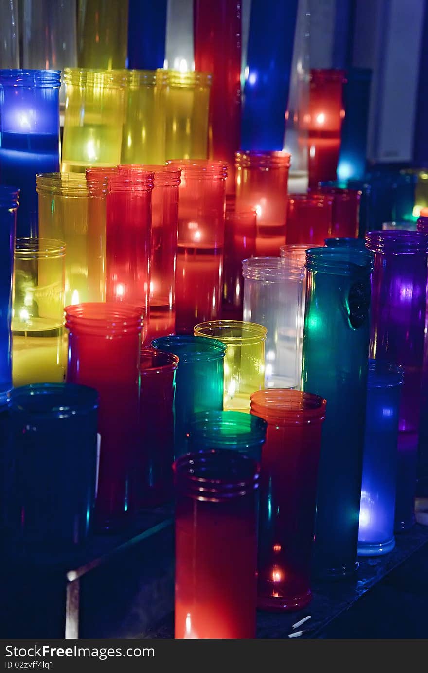 Colored votive candles in church