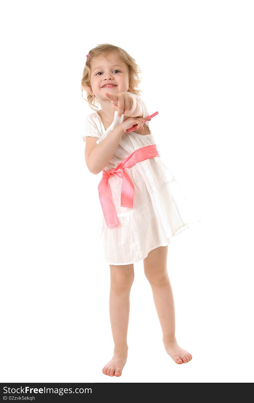 Amazed little girl wearing a white dress standing on white background