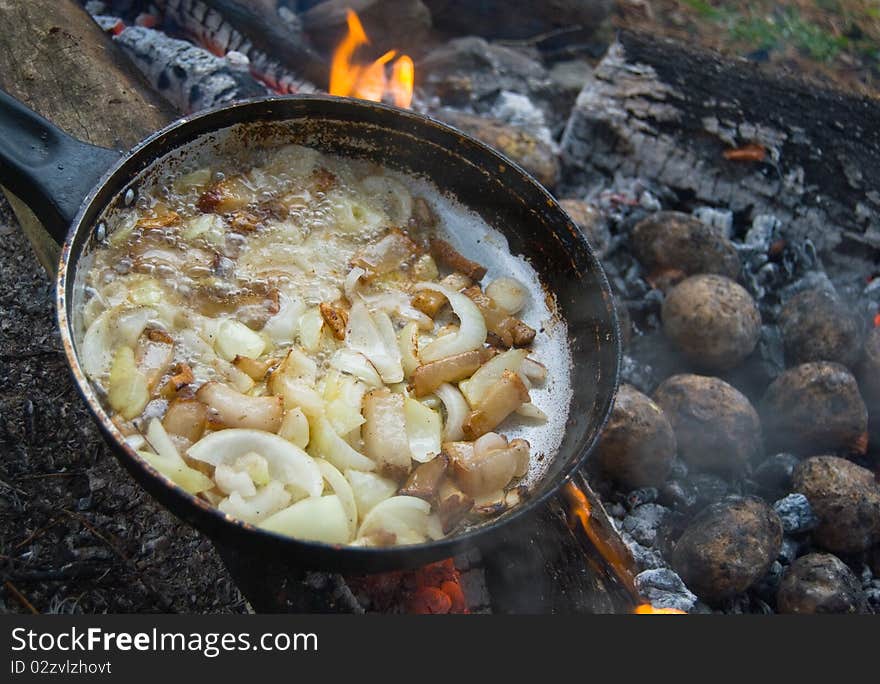 Yummy barbecue with lard, onion and potatoes