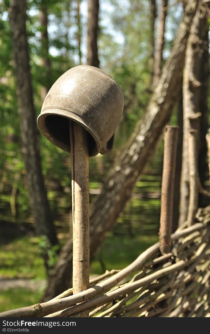 Clay pot on the fence