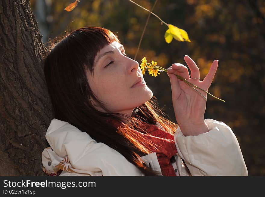 Young beautiful romantic woman in the forest