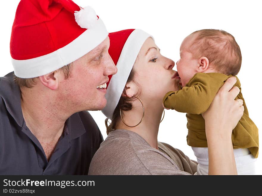 Young happy family with a baby girl getting ready for chirstmas. Young happy family with a baby girl getting ready for chirstmas.