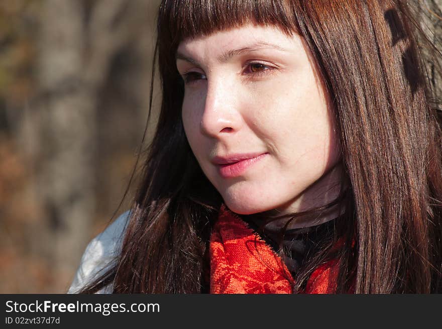 Young beautiful romantic woman in the forest