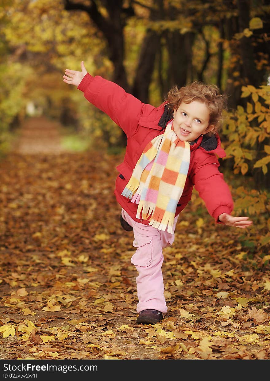 Little girl with scarf during autumn