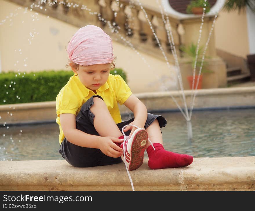 Little girl and a shoe