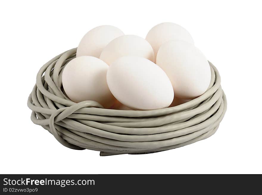 Eggs lay in a nest made of a cable. Symbolizes a birth of new technologies. Closeup. Isolated on the white. On eggs it is possible to write the name of new technologies, for example ISDN, FTTB, GPON. Eggs lay in a nest made of a cable. Symbolizes a birth of new technologies. Closeup. Isolated on the white. On eggs it is possible to write the name of new technologies, for example ISDN, FTTB, GPON