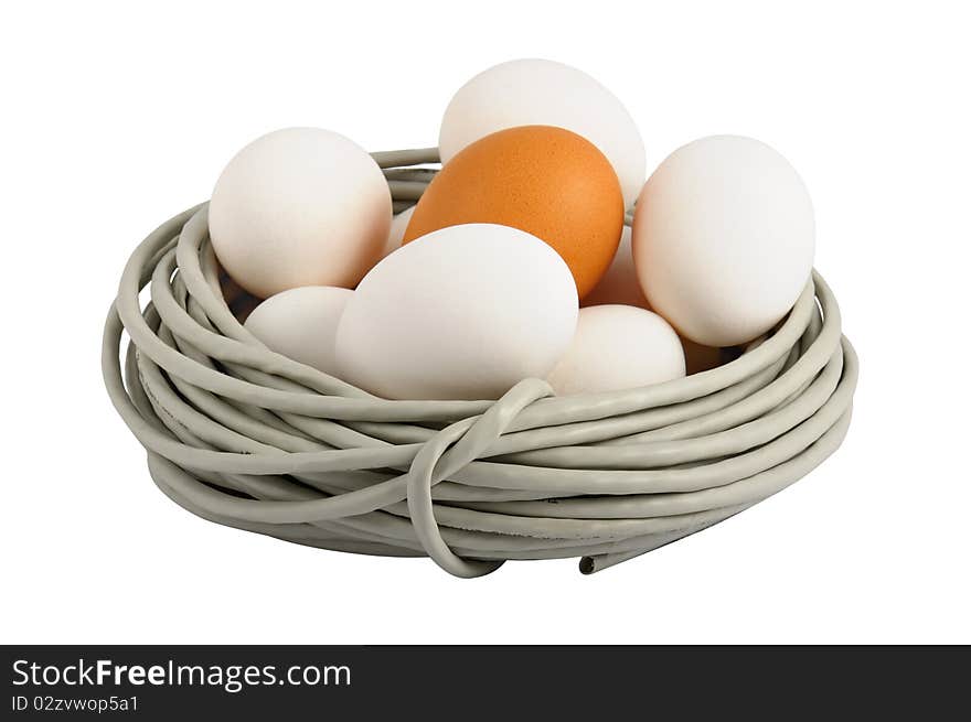 Eggs lay in a nest made of a cable. Symbolizes a birth of new technologies. Closeup. Isolated on the white. On eggs it is possible to write the name of new technologies, for example ISDN, FTTB, GPON. Eggs lay in a nest made of a cable. Symbolizes a birth of new technologies. Closeup. Isolated on the white. On eggs it is possible to write the name of new technologies, for example ISDN, FTTB, GPON