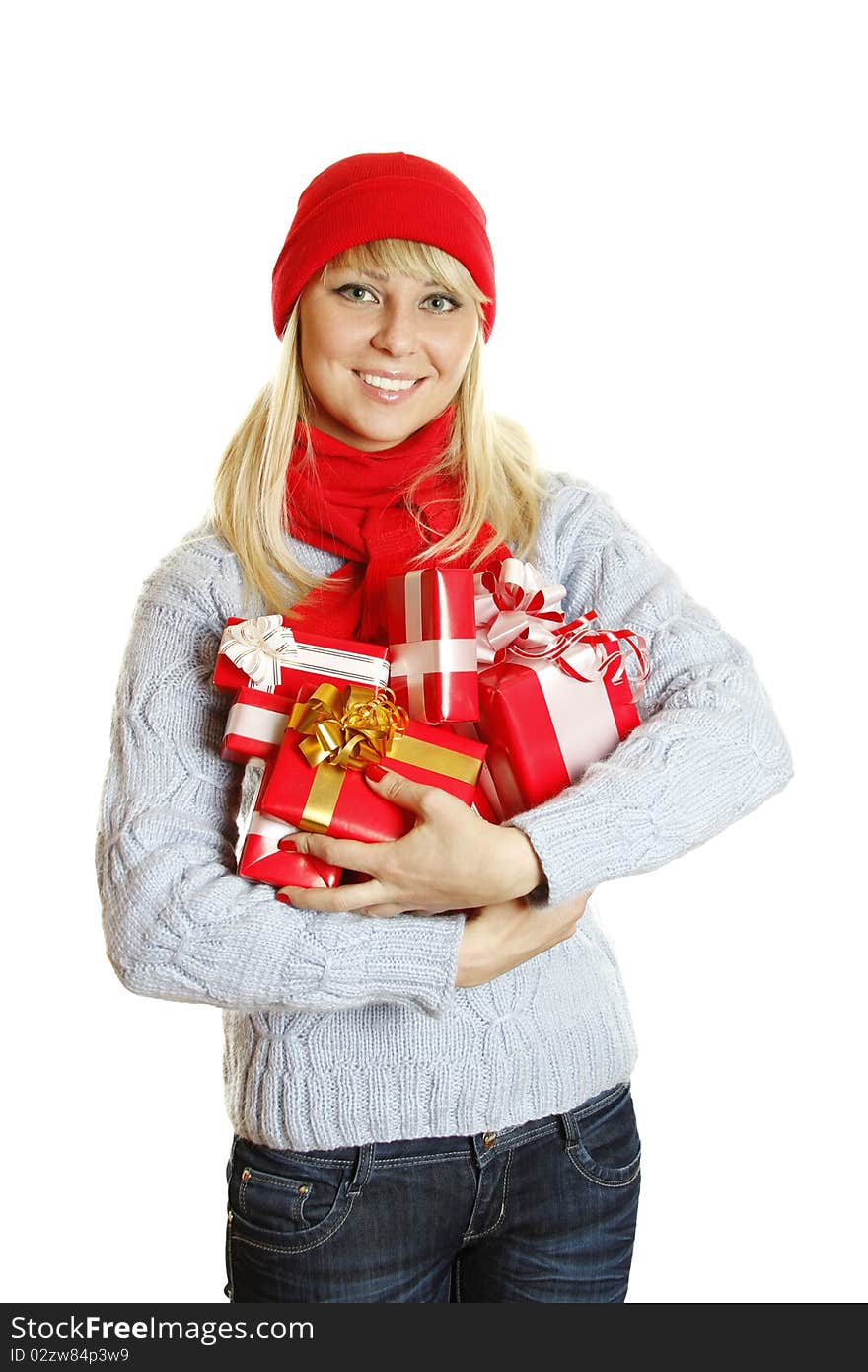 Young beautiful woman in a blue knitted sweater, red hat and red scarf hold many different sizes Christmas gift boxes. Young beautiful woman in a blue knitted sweater, red hat and red scarf hold many different sizes Christmas gift boxes.