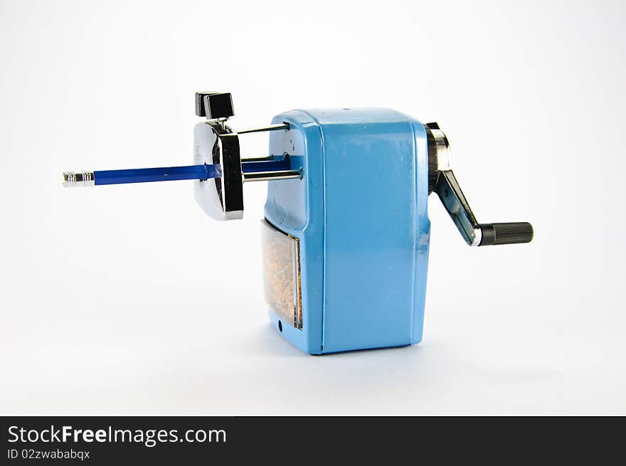 Blue pencil sharpener on white background