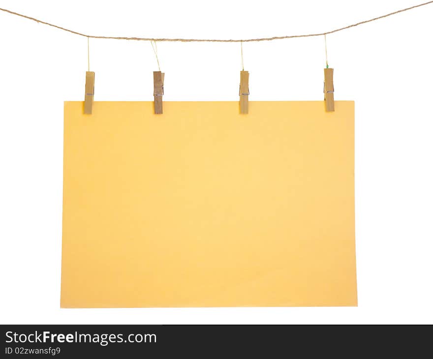 Orange blank paper sheet on a clothes line. Isolated on white background. Orange blank paper sheet on a clothes line. Isolated on white background.