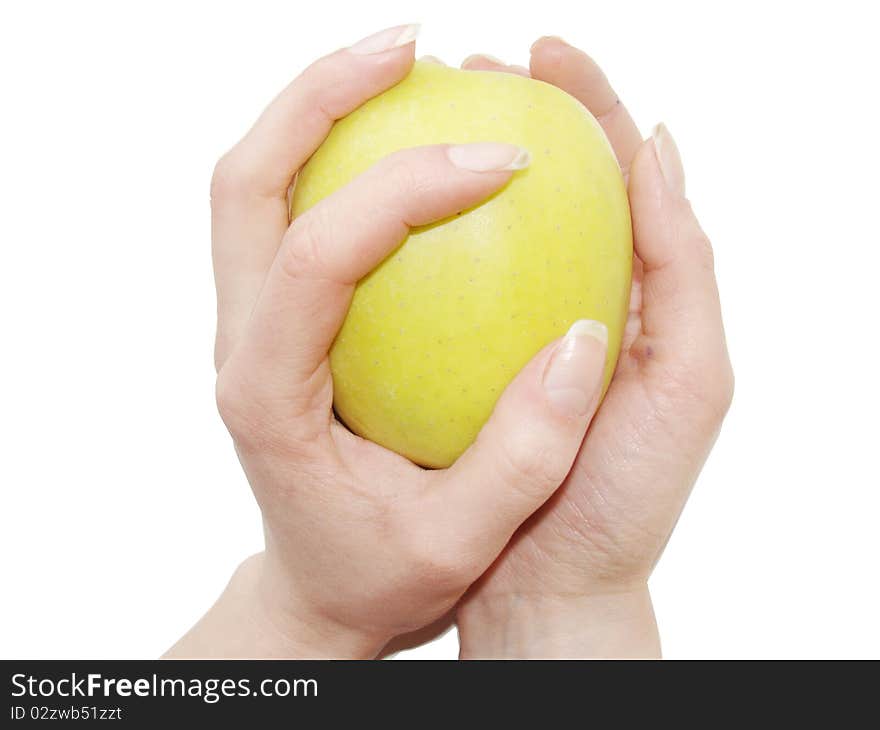 Apple in female hands close up