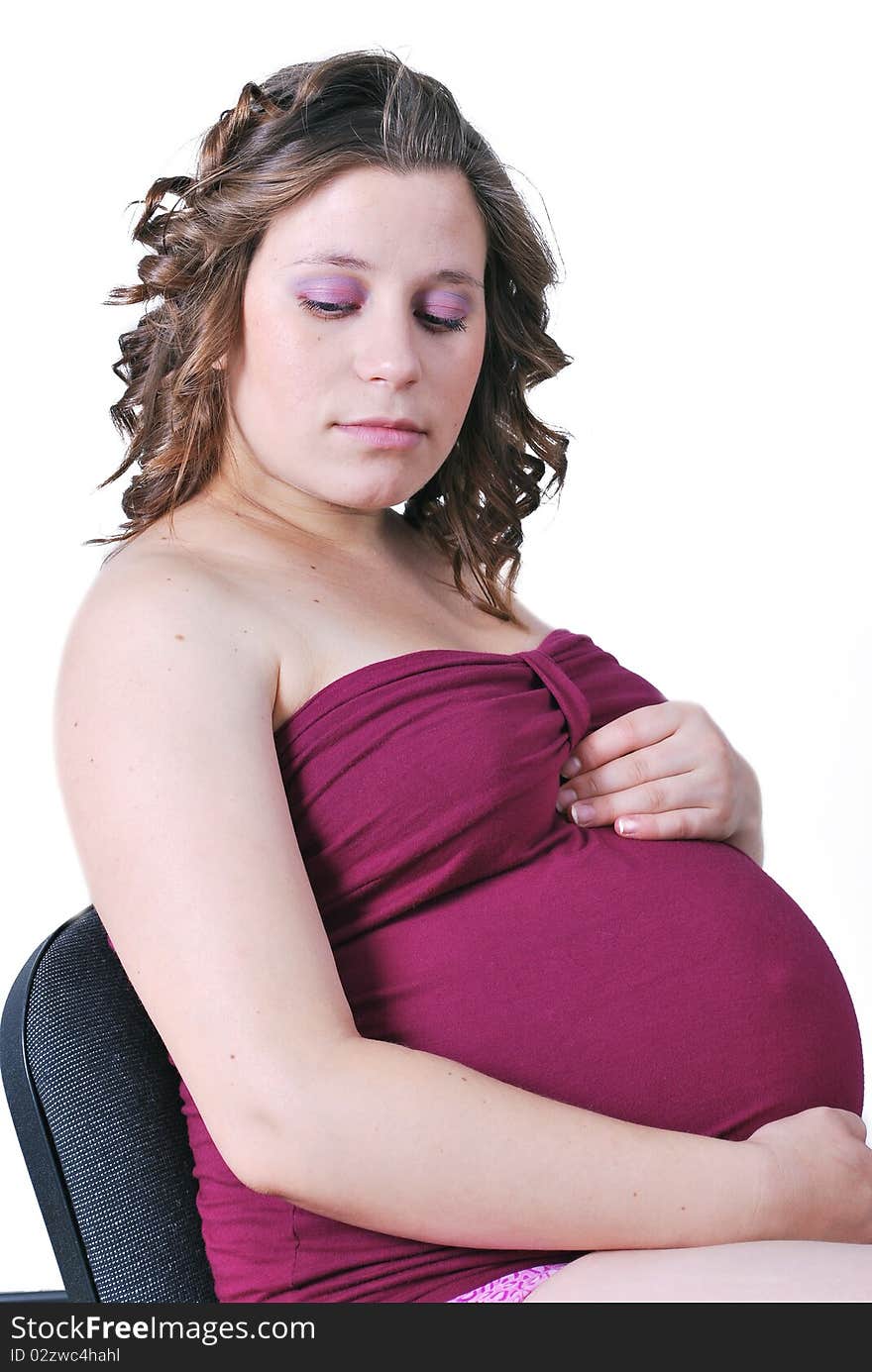 Pregnant woman holding belly with arms. Pregnant woman holding belly with arms