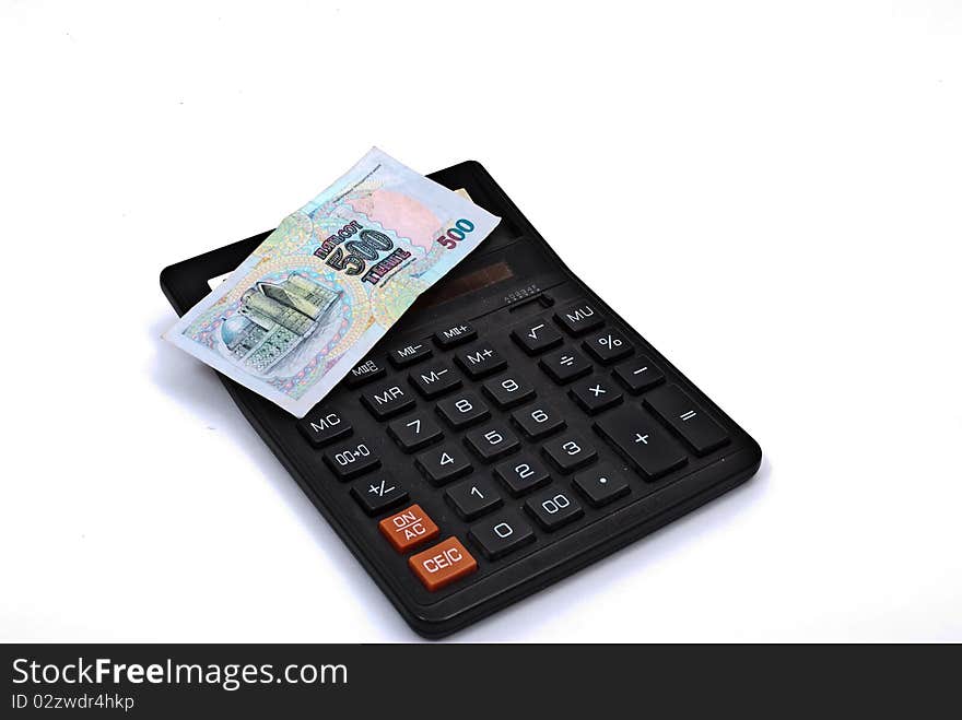 Calculator and currency on white background