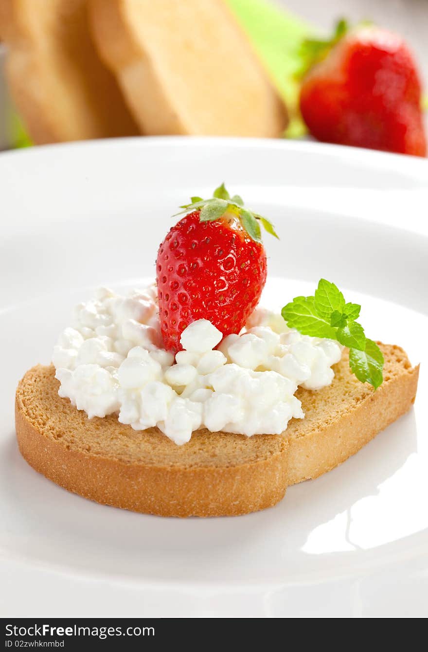 Rusk with cottage cheese and strawberry. Rusk with cottage cheese and strawberry