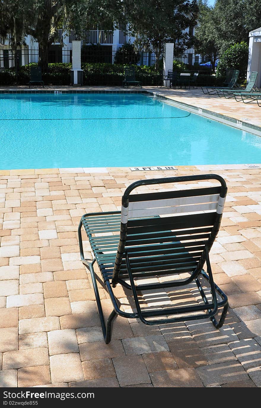 Chair in front of a swimming pool