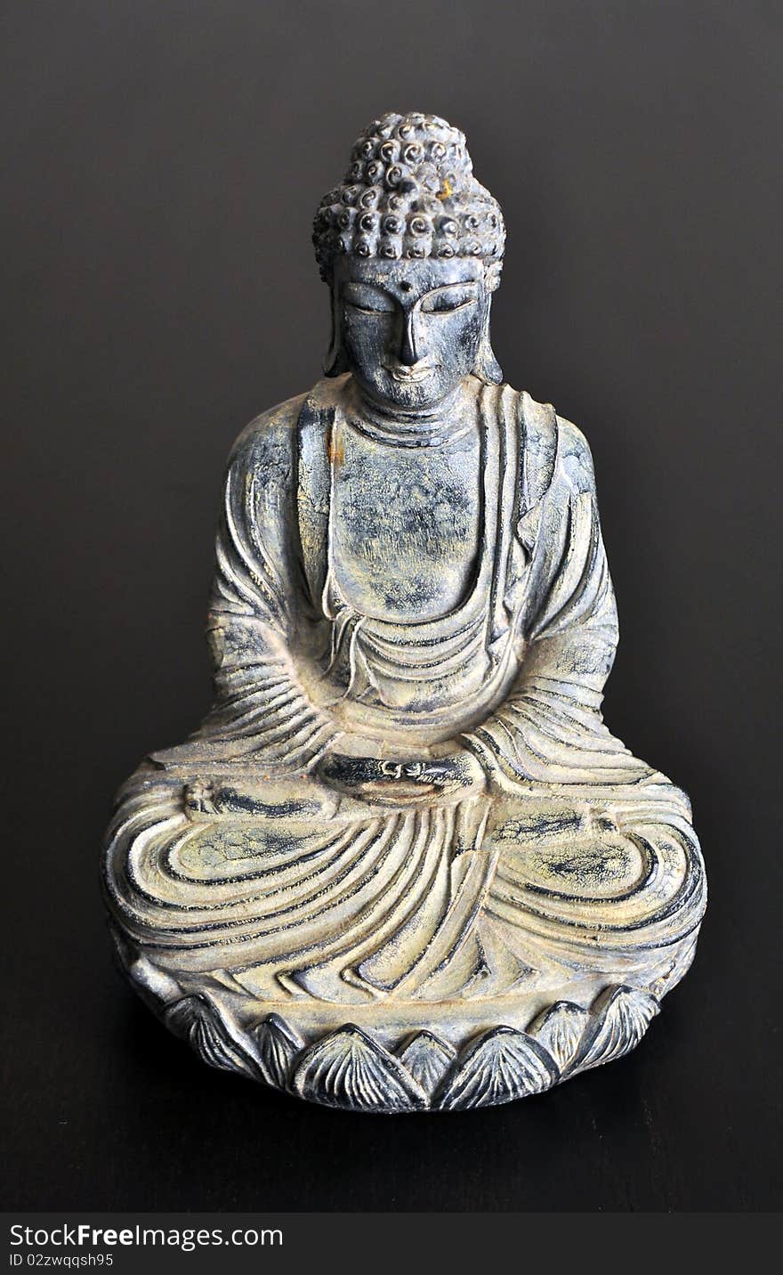 Isolated Buddha statue made of stone