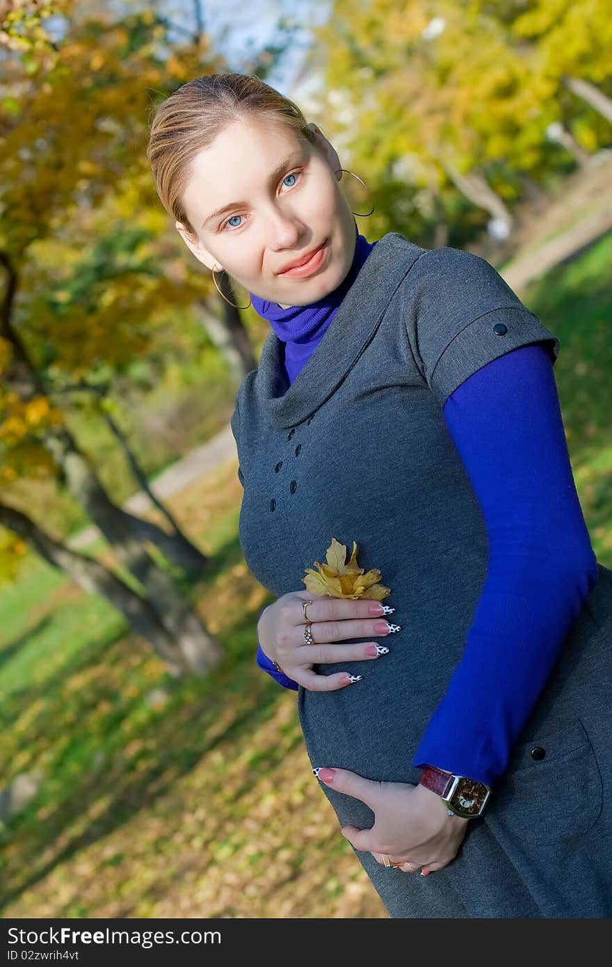 Beautiful pregnant woman in the park. Beautiful pregnant woman in the park