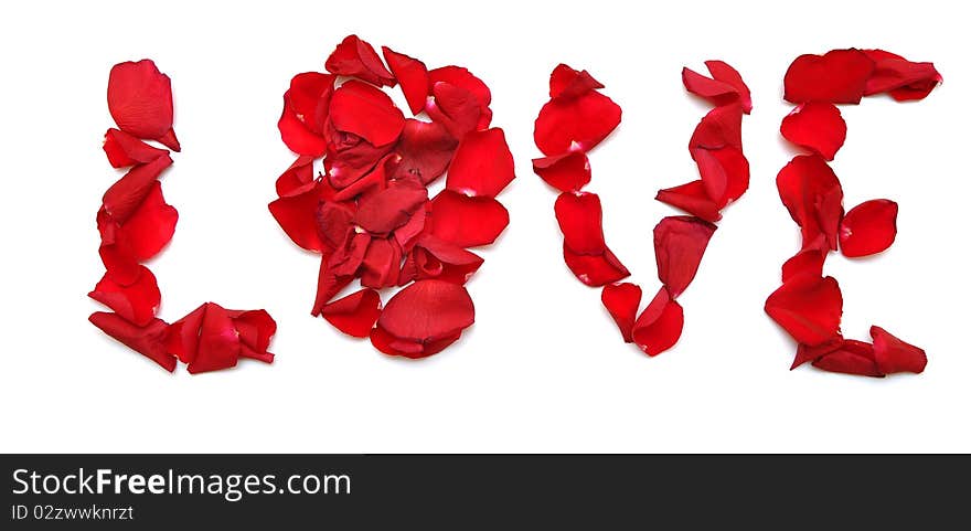 Word LOVE made of petal red rose on white