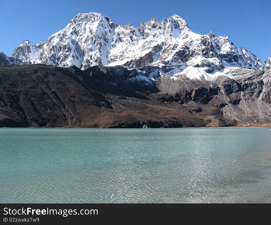 View of a lake and high mountain in the Nepal Himalaya. View of a lake and high mountain in the Nepal Himalaya