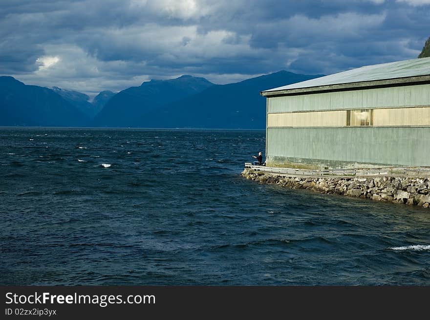 View of Sognefjord with a fisherman