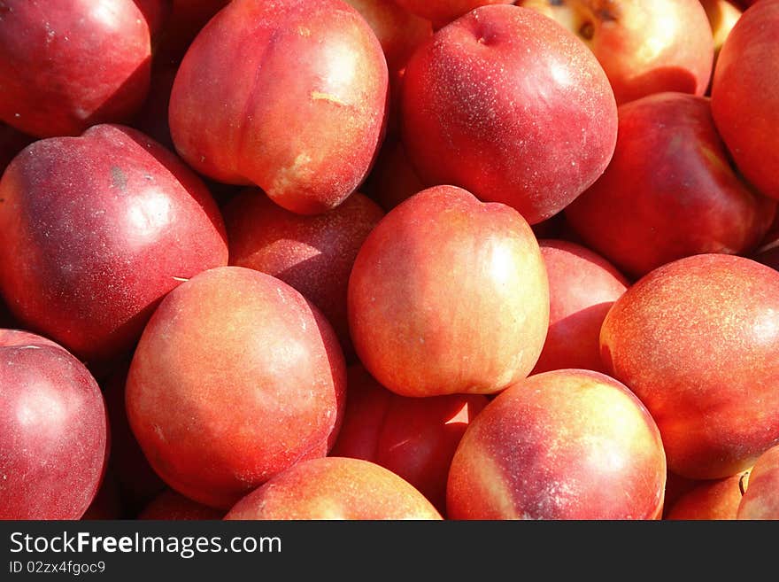 Juicy, fresh peaches are on the table. Juicy, fresh peaches are on the table