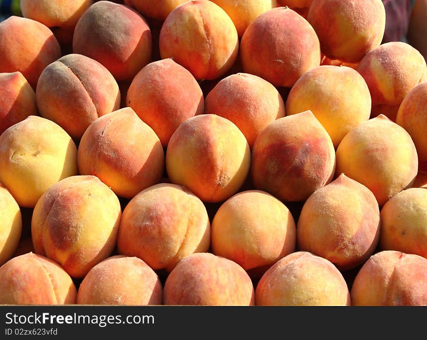 Juicy, fresh peaches are on the table. Juicy, fresh peaches are on the table