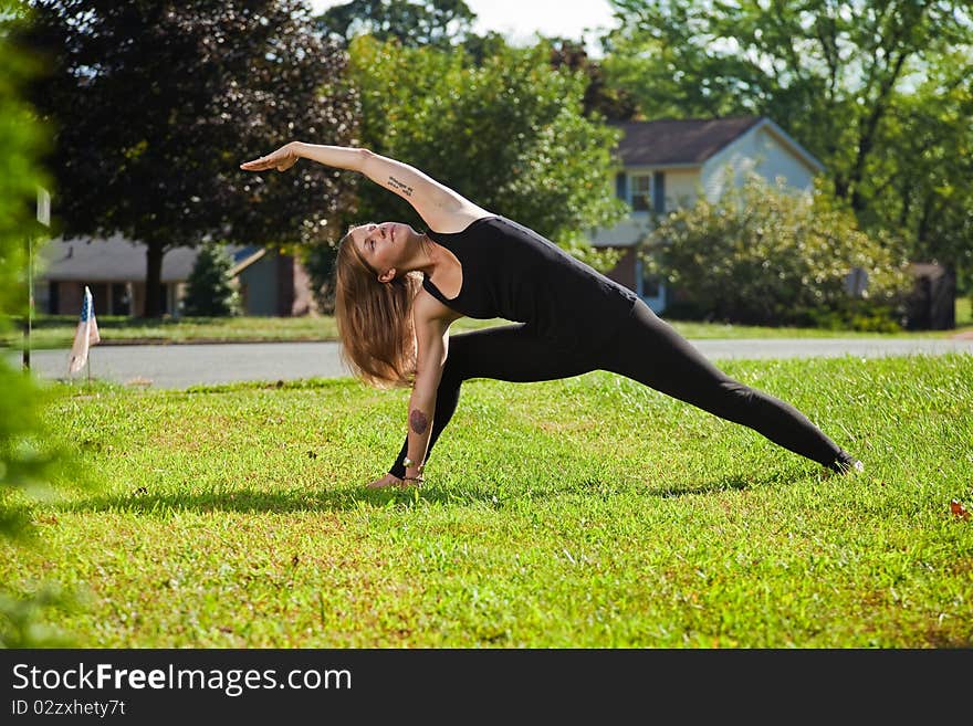 Young girl doing yoga exercise alone