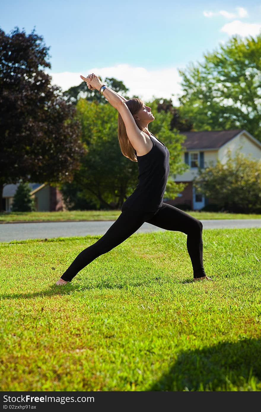 Young girl doing yoga exercise alone