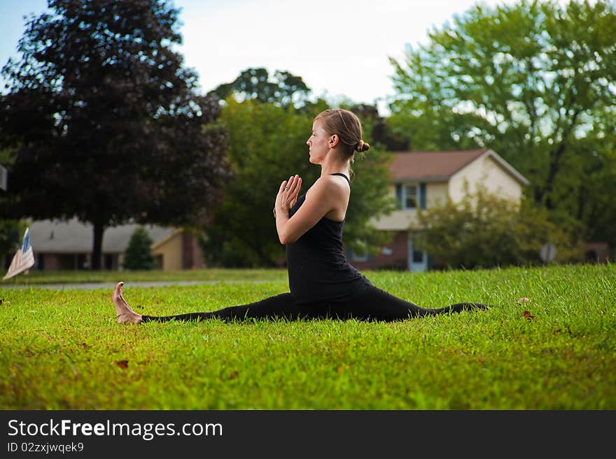 Young girl doing yoga exercise alone