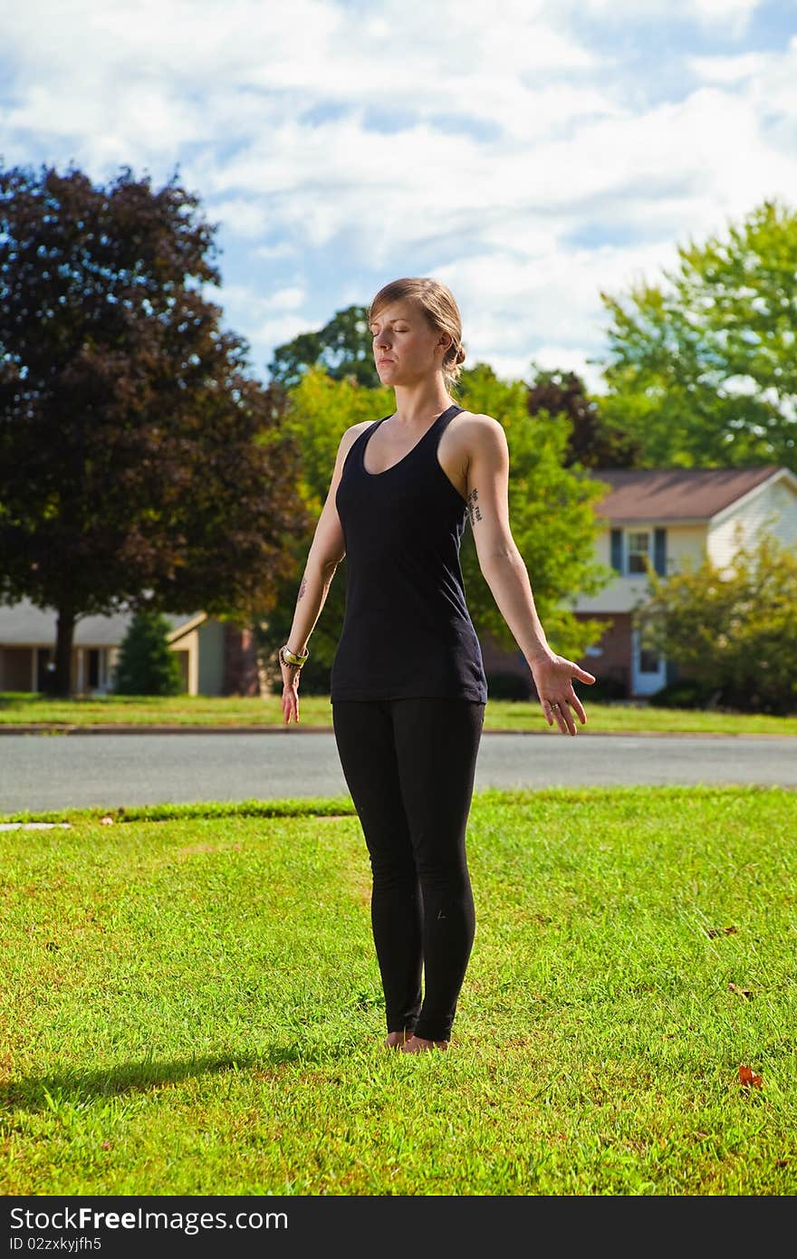 Young girl doing yoga exercise alone