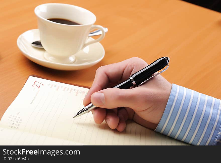 A young business man working in an office at his workplace.