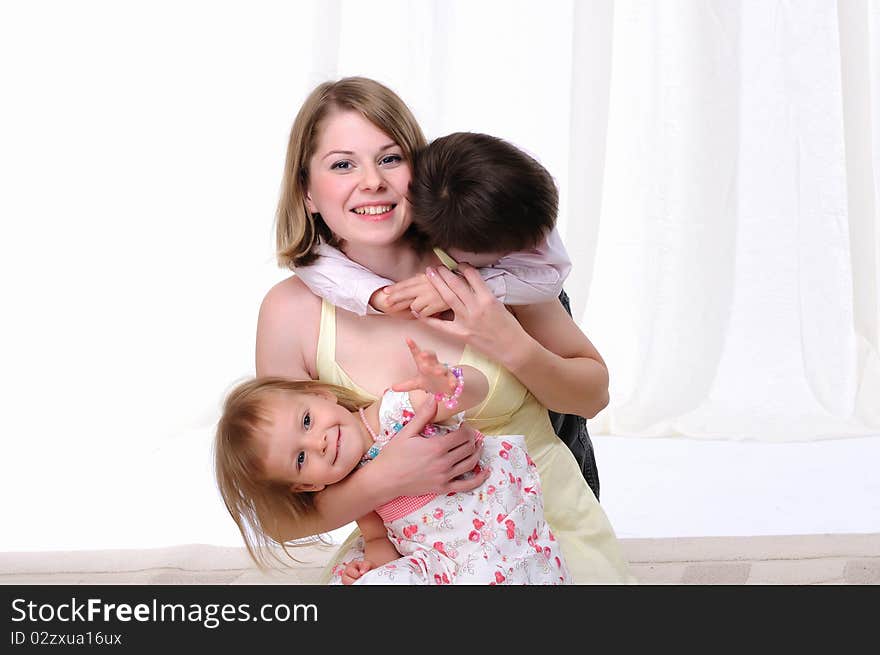 Mom, her son and her little daughter together having fun