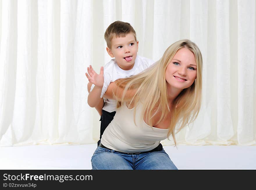 Young mother and son having fun together