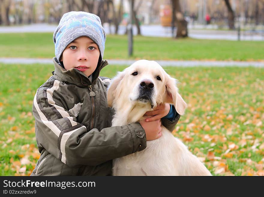 Boy playing in autumn park