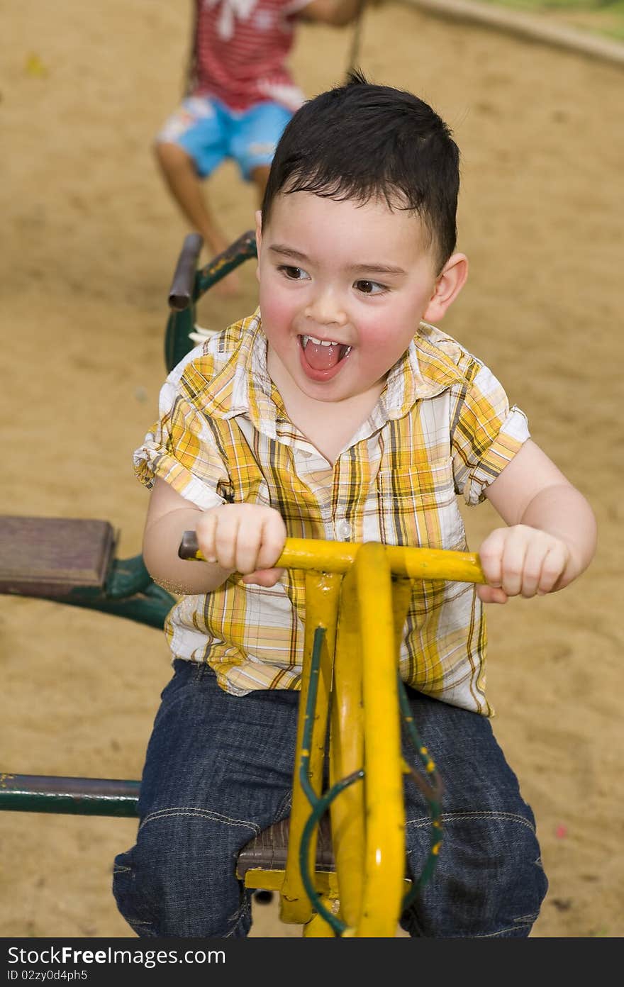 Cute boy on a carousel