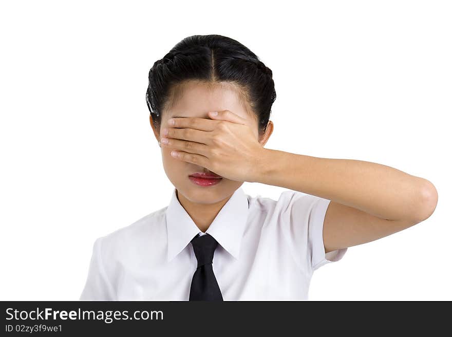 Young businesswoman covering her eyes with one hand, isolated on white background