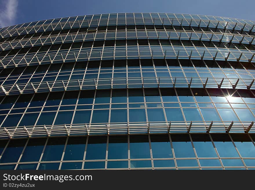 Modern office building facade in bright summer day