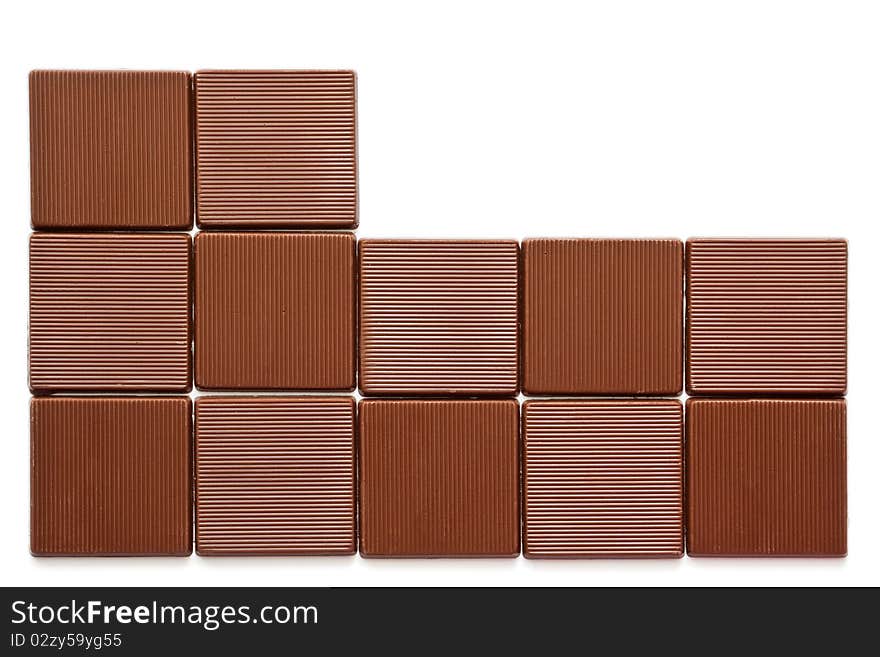 Pieces of chocolate on a white background. Pieces of chocolate on a white background