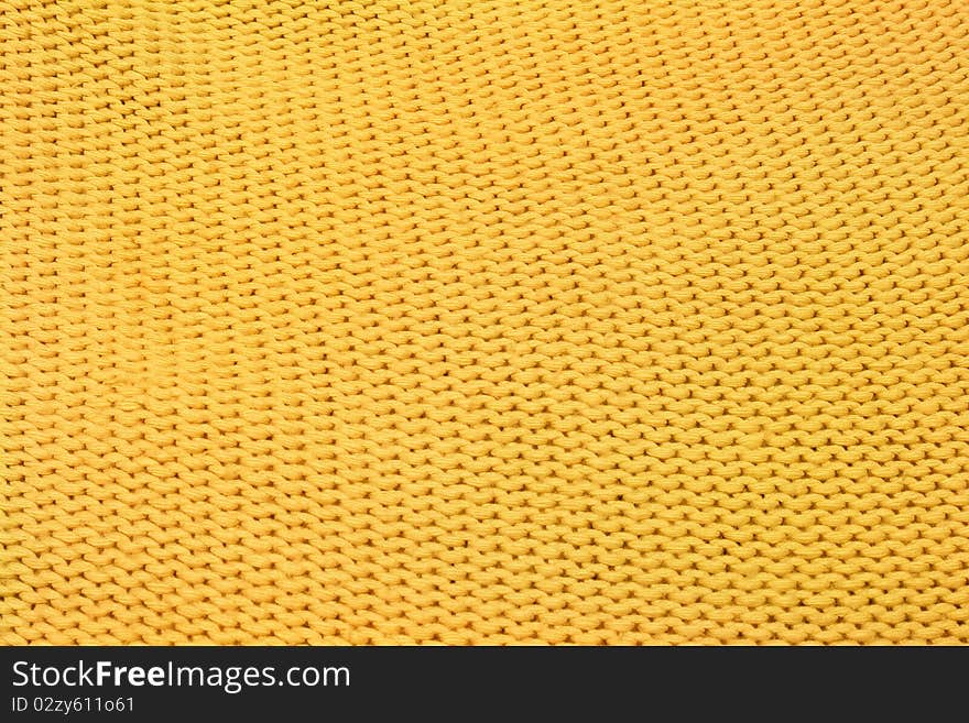 Home knitting yellow texture as background. Home knitting yellow texture as background