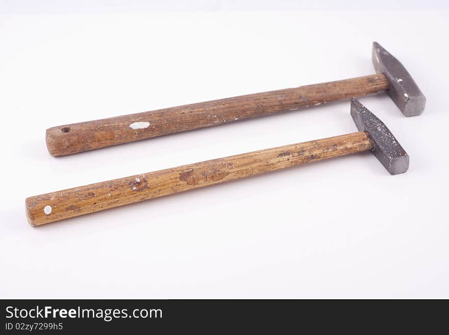 Old used small rusty hammers isolated on white background. Old used small rusty hammers isolated on white background.