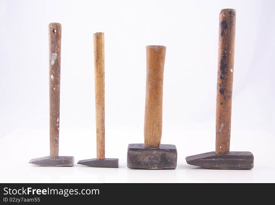 Old used small rusty hammers isolated on white background. Old used small rusty hammers isolated on white background.