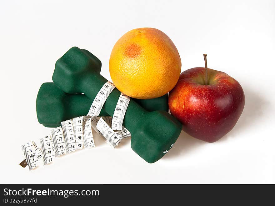 Dumbells Wrapped In Measure Tape With Fruits