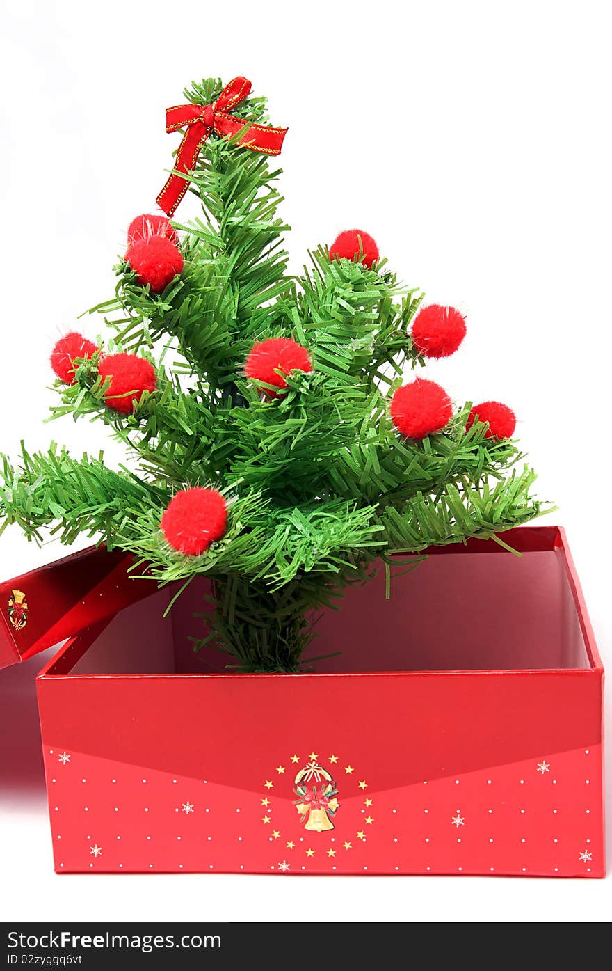 Red gift box and christmas tree on isolated background