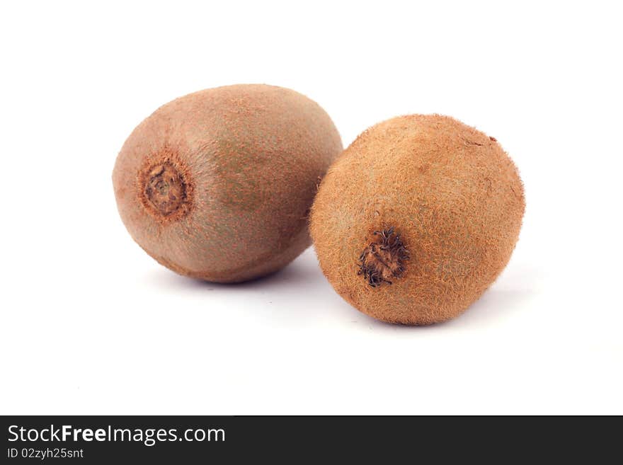 Two whole kiwifruits isolated on white background.